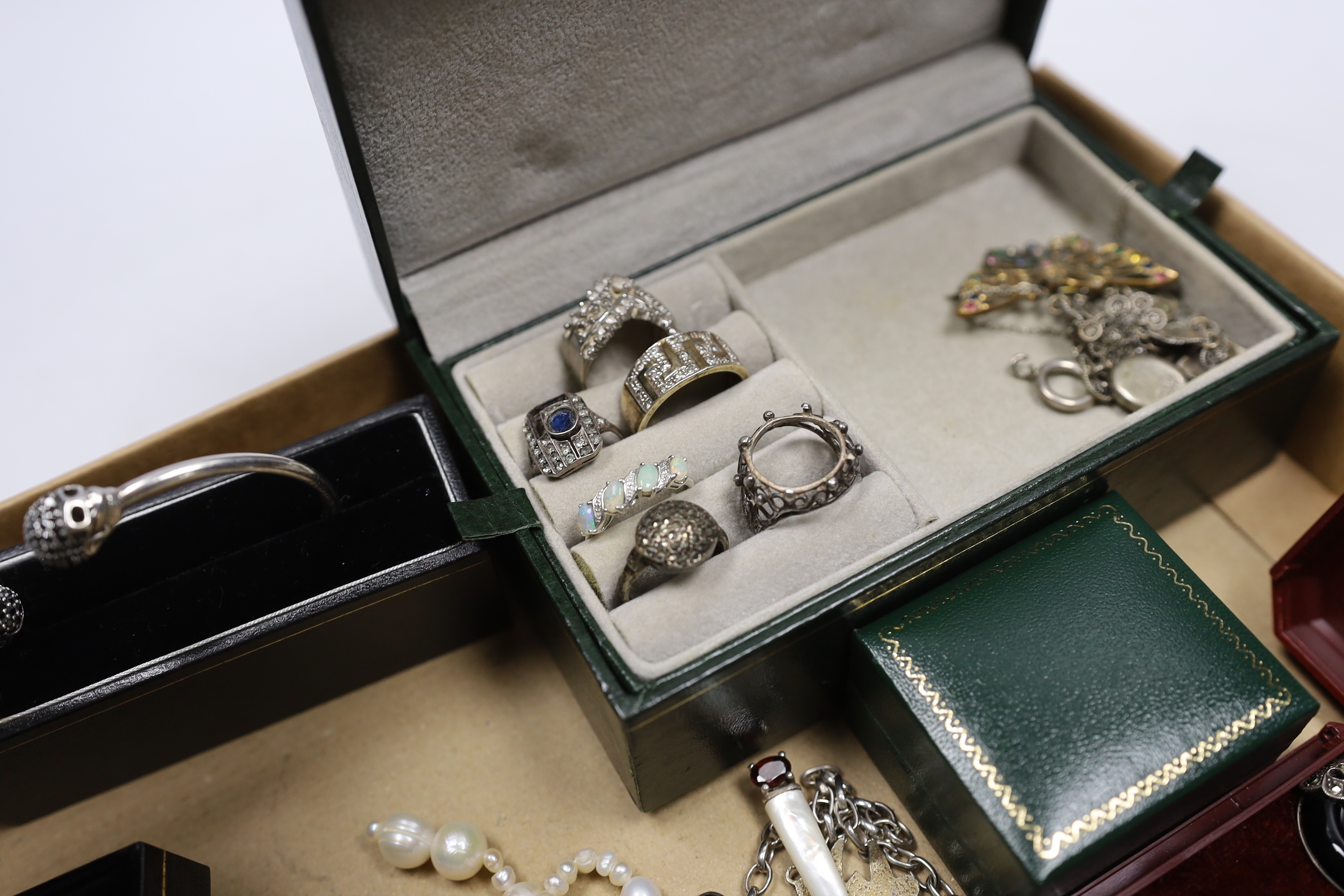 A quantity of assorted silver, 925, white metal and other jewellery including torque necklace, cross pendant necklace, marcasite and onyx set drop earrings, enamelled cross brooch, bangle, medals, dress rings, freshwater